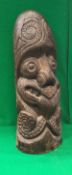 A 20th Century Polynesian style carved hard wood Tiki post head with tattooed face grimacing with