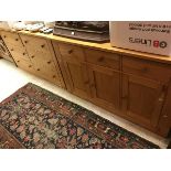 A light oak sideboard,