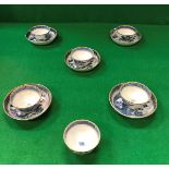 A set of six 19th Century Chinese blue and white tea bowls with gilt decoration,