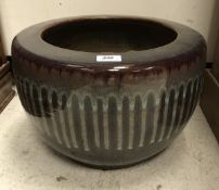 A large ceramic Japanese Bonsai pot with sang de boeuf glaze
