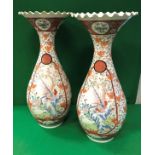 A pair of 19th Century Japanese Meiji Period Kutani baluster shaped vases with flared crimped rims,