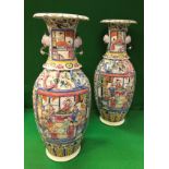 A pair of 19th Century Chinese famille-rose vases with lobed flared rims and exotic bird handles
