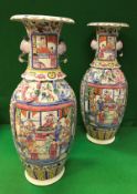 A pair of 19th Century Chinese famille-rose vases with lobed flared rims and exotic bird handles