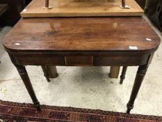 An early 19th Century mahogany tea table,