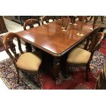 A modern reproduction mahogany extending dining table in the Victorian manner the top with moulded