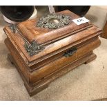 An oak box of bombe form raised on bracket feet