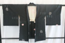 A circa 1940 silk haori (jacket) with Shibori (tie-dyed) decoration on a black ground