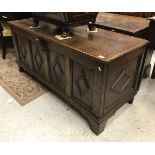 An oak four panel coffer