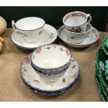 A pair of Newhall polychrome decorated pottery tea bowls and saucers with writhen decoration