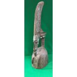 An African carved treen ware copper and shell embellished headdress or helmet as a female form,