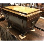 A 19th Century Irish mahogany wine cooler of sarcophagus form,