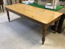 A modern pine farmhouse style kitchen table in the Victorian manner