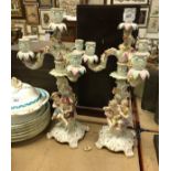 A pair of 19th Century Meissen table candelabra with figural column supports