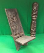 An African carved wooden seat decorated with figure grinding corn together with a totem style