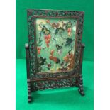 An early 20th Century Chinese jade and hardstone table screen decorated with squirrel upon a tree