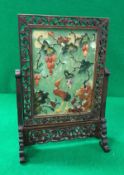 An early 20th Century Chinese jade and hardstone table screen decorated with squirrel upon a tree