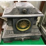 A Victorian black marble cased mantle clock of architctural form,