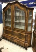 A 19th Century Dutch marquetry inlaid display cabinet the upper section with moulded cornice over