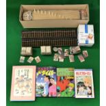A miniature koto, together with two abacus,
