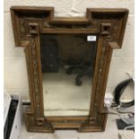 A gilt framed mirror in the Arts and Crafts style with bevelled plate