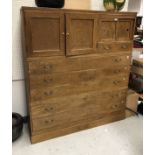 An early 20th Century Japanese ash kimono cupboard enclosing multiple cupboards and drawers