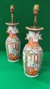A pair of Chinese famille-rose baluster shaped vases with relief work and gilt decorated