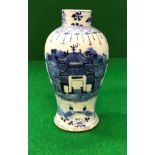 A Chinese blue and white baluster shaped vase decorated with wall and temple gateway with figures