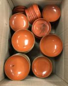 A collection of early 20th Century Japanese red lacquered bowls and plates, the bowls with lids,