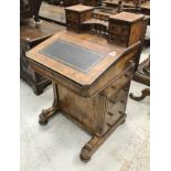 A Victorian walnut Davenport desk with four drawer superstructure over a sloping writing surface