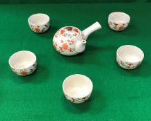 A 20th Century Japanese tea set decorated in oxide red and green with floral sprays comprising