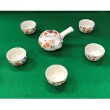 A 20th Century Japanese tea set decorated in oxide red and green with floral sprays comprising