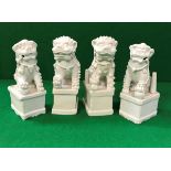 A collection of four Chinese blanc-de-chine figures of temple lions,