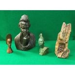 An African carved green stone figural bust of a tribal chieftain,
