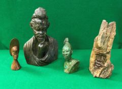 An African carved green stone figural bust of a tribal chieftain,