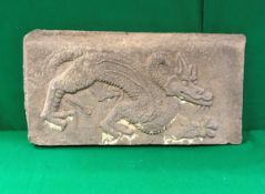A Chinese Yuan dynasty (1279-1368 AD) stone panel of rectangular form carved with scaly dragon