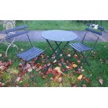 A metal two seat bistro set together with a pine wall mounted plate rack and a set of brass balance