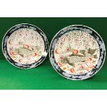Two Japanese polychrome decorated plates, the centre field painted with carp and blossom,