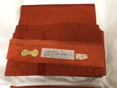 A circa 1970 silk Nagoya obi with Muji (plain) orange ground,