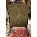 An early 20th Century walnut framed fire screen in the Louis XV taste with gros and petit point