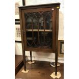 An Edwardian mahogany and inlaid single door display cabinet,