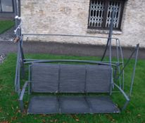 A modern painted metal framed swing seat and a modern metal framed garden chair