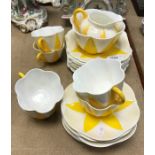 A Shelley yellow and white glazed part tea set approximately 6 place settings, registered design No.