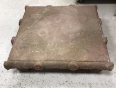 An 18th Century Indian carved stone plinth of square form,