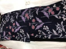 A circa 1950 wool kimono with Kusa Bana (wild flower) decoration on a dark blue ground