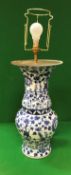 A Chinese blue and white porcelain vase as a table lamp with all-over floral decoration
