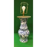 A Chinese blue and white porcelain vase as a table lamp with all-over floral decoration