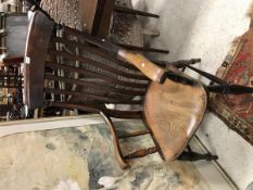 A Victorian beech and elm slat back Windsor armchair on turned and ringed legs united by stretchers,