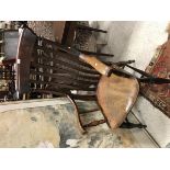 A Victorian beech and elm slat back Windsor armchair on turned and ringed legs united by stretchers,