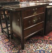 A modern Chinese stained hardwood chest with one long drawer over two short drawers opening to