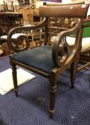 A set of five Regency mahogany bar back dining chairs with drop in seats on turned and octagonal